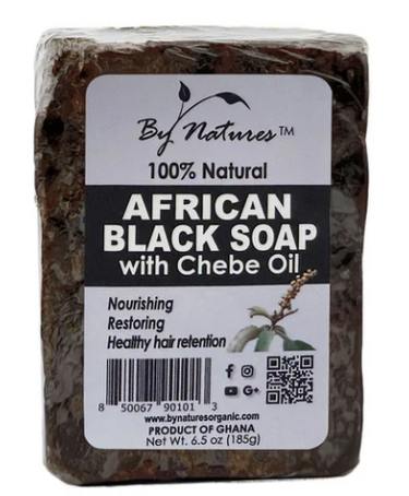 Block of African Black Soap with Chebe Oil on a white background